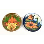 PHILLIP GIBSON FOR MOORCROFT; a circular dish decorated with 'Flame of the Forest' pattern,