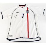 DAVID BECKHAM; an England Umbro 2001 home shirt, signed and further inscribed 'Love' with 7 printing