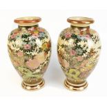 A pair of Japanese Satsuma vases of inverted baluster form, decorated with stylised bird and