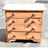 An old pine chest of four drawers, raised on bracket feet, length 84.5cm, depth 48cm, height 75cm.