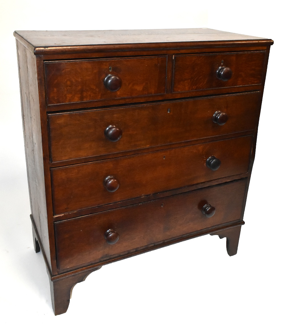 A 19th century oak chest of two short over three long drawers, raised on bracket feet, length