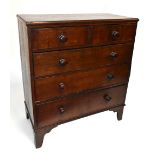 A 19th century oak chest of two short over three long drawers, raised on bracket feet, length