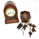 An Edwardian mahogany lancet top mantel clock, the circular dial set with Roman numerals, raised