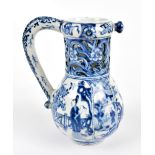 An 18th century Chinese porcelain blue and white puzzle jug painted with figures inside panels,