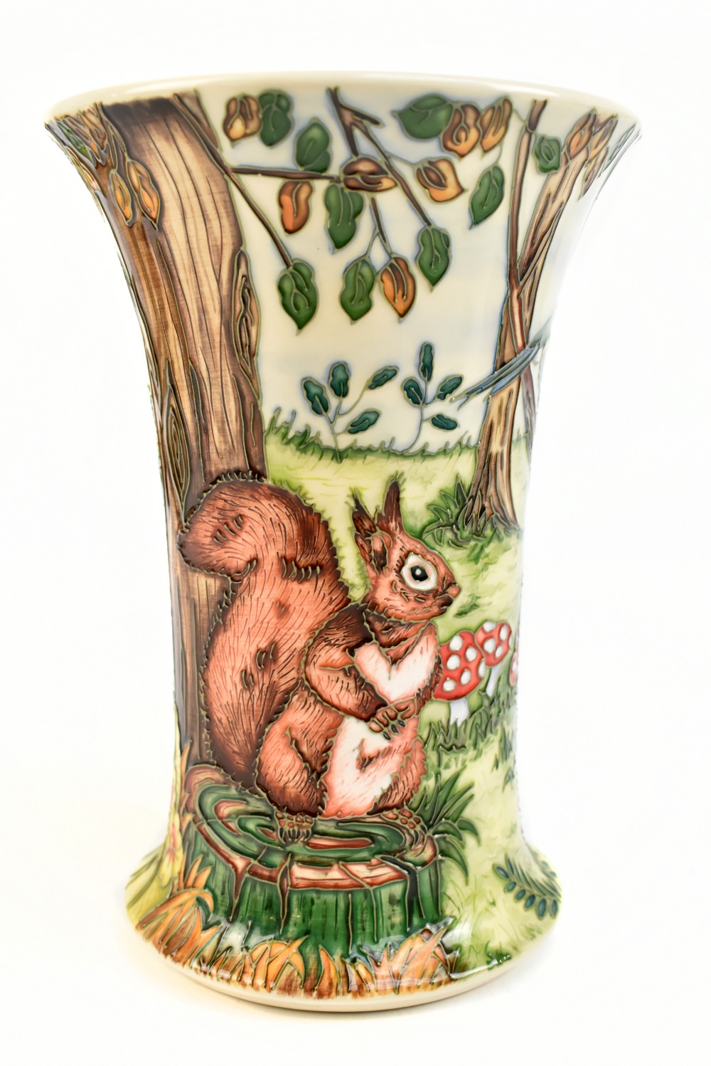 MOORCROFT; a trumpet vase decorated with a squirrel and toadstools in a landscape setting, sign