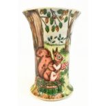 MOORCROFT; a trumpet vase decorated with a squirrel and toadstools in a landscape setting, sign