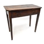 An oak single drawer side table with associated two plank top, raised on square section tapering