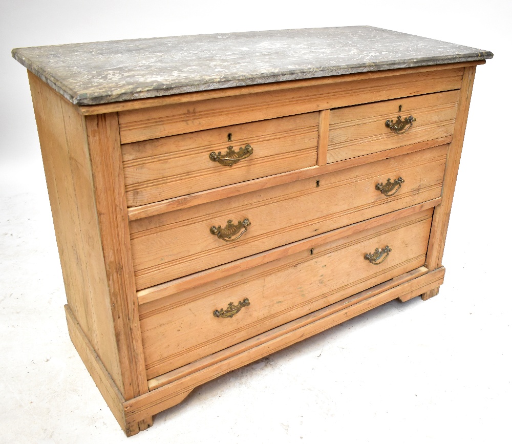 An old pine marble topped chest of two short over two long drawers, raised on bracket feet, length