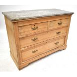 An old pine marble topped chest of two short over two long drawers, raised on bracket feet, length