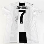 CRISTIANO RONALDO; a Juventus Adidas home shirt, signed with 'Ronaldo 7' printing to reverse, size