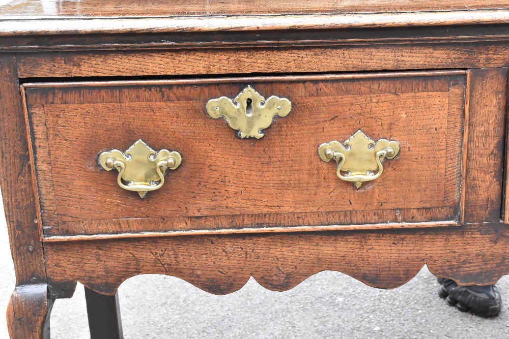 An 18th century oak dresser of low proportions, the plate rack back with carved and moulded - Image 2 of 6