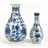 A Chinese blue and white floral decorated baluster vase with spurious Xuande mark to base, height