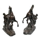 AFTER GUILLAUME COUSTOU; a very large pair of late 19th century bronze Marly horses, each bearing