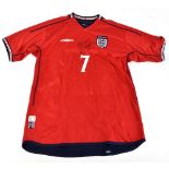 DAVID BECKHAM; an England Umbro 2002 away shirt signed to front and further inscribed 'Best