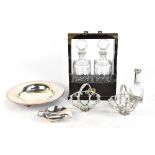 A modern mahogany effect brass bound tantalus enclosing two decanters, a pair of silver plated