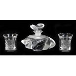 LALIQUE; a clear scent bottle of stylised form with stopper, width 9.5cm, and two shot glasses
