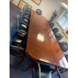 A large reproduction Regency-style mahogany and crossbanded quadruple pedestal boardroom table,