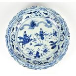 A good and large Chinese porcelain bowl with shaped rim painted in underglaze blue in the