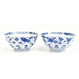 A pair of 18th century Chinese porcelain floral moulded bowls painted in underglaze blue with floral