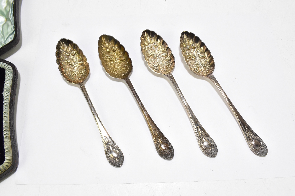 WALKER & HALL; a cased set of four Victorian hallmarked silver berry spoons, with cast decoration to - Image 2 of 4