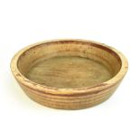 A rustic treen dairy bowl of circular form with painted linear decoration, diameter 54cm. Additional