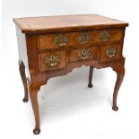 A George II walnut and mahogany crossbanded boxwood strung lowboy, the moulded rectangular top