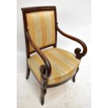 A 19th century French Empire mahogany elbow chair with padded back, scrolling swept arms, padded