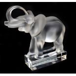 LALIQUE FRANCE; a clear and frosted glass model elephant, signed to rim, height 16cm, length 14cm.