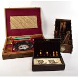 An English made cased games compendium housing a Roulette wheel, chess pieces, checkers, chess