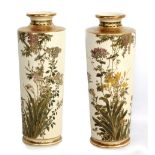 SENZAN; a pair of large Japanese Satsuma cylindrical vases decorated with birds amongst blossoming