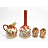 Four pieces of Japanese Kutani ware to include an onion vase painted with stylised birds and