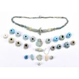 A group of Ancient Egyptian turquoise faience jewellery beads and a necklace on modern stringing,