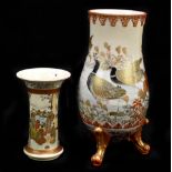 A Japanese Meiji period porcelain Satsuma vase decorated with ducks upon a pond, on three