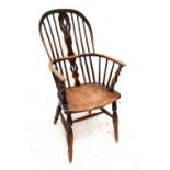 A mid-19th century ash and elm high hoop back Windsor-type elbow chair.Additional InformationThere