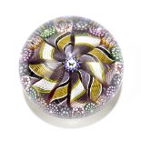 MIKE HUNTER; a contemporary glass paperweight with central butterfly flanked by twist latticinio