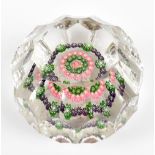 CLICHY; a 19th century paperweight with central floral canes inside facet panels, diameter 6cm, with