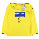 ALAN SHEARER; a Newcastle United Puma fluorescent yellow away shirt, signed and further inscribed '