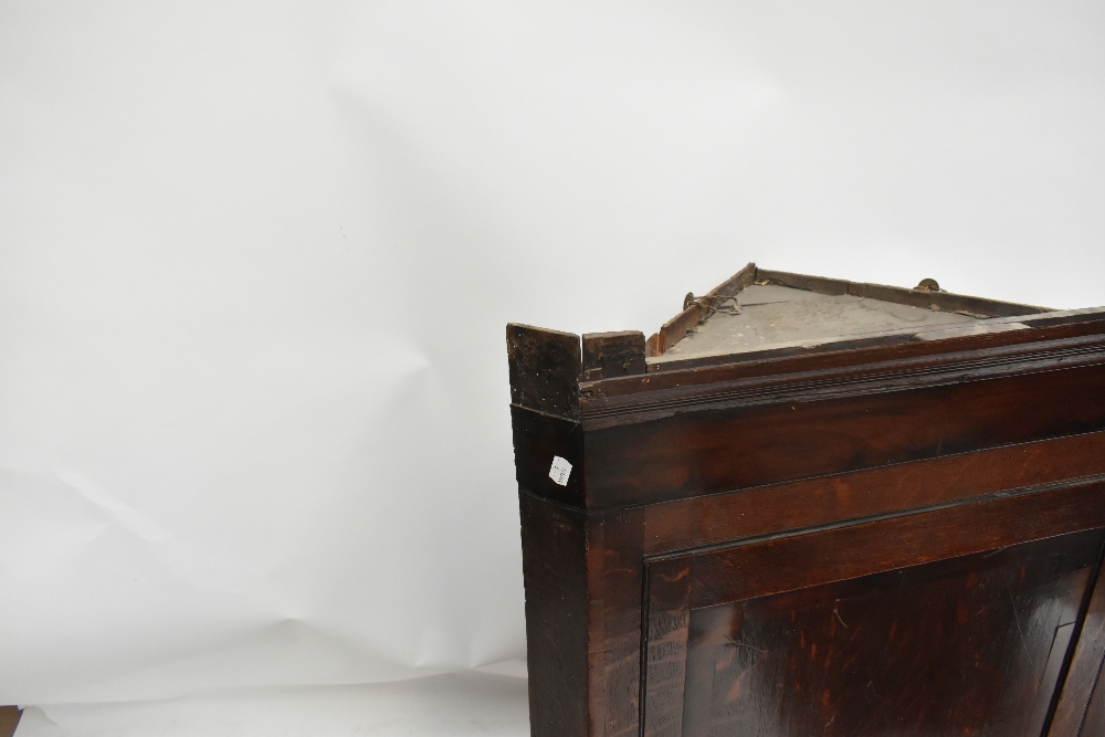 An 18th century oak flat fronted hanging corner cupboard, the single panelled door above three - Image 2 of 4