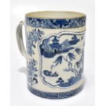 An 18th century Chinese blue and white porcelain mug, the central panel painted with a variant of