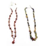 Two necklaces comprised of Roman and earlier ancient beads including carnelian, turquoise and