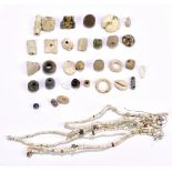 A group of ancient jewellery beads, one fashioned as a necklace on modern stringing, of varied