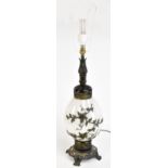A large decorative table lamp, relief decorated with trailing flowers on a satin glass background,