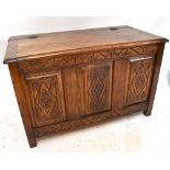 A small 20th century carved oak coffer.