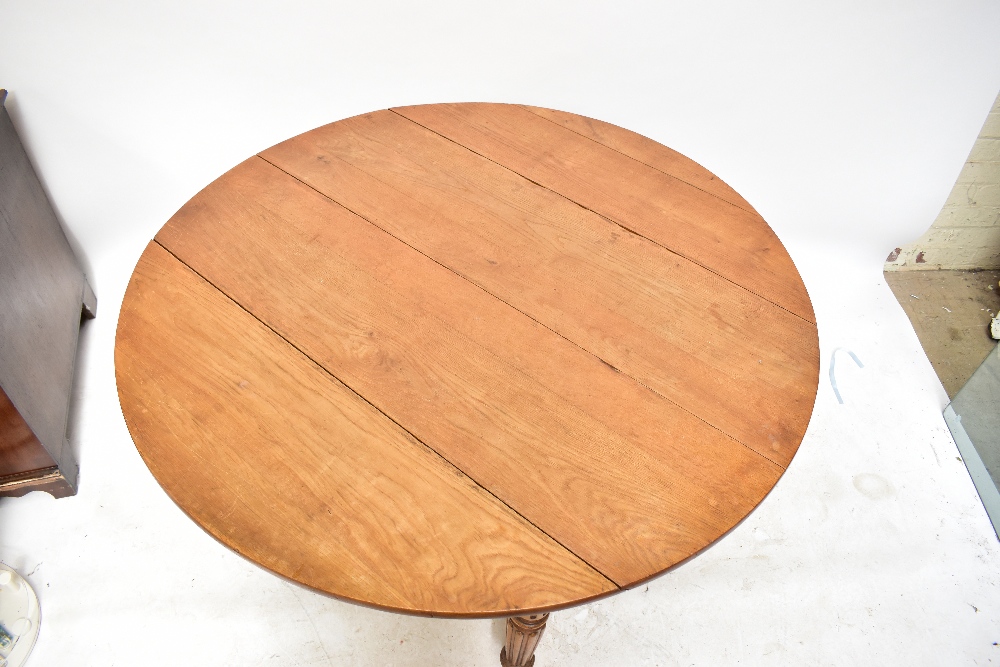 A late 19th century French oak extending dining table with rounded rectangular top on fluted legs to - Image 4 of 8