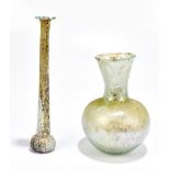 A Roman 'candlestick' unguentarium of tapered form with iridescence, length 19cm, and an