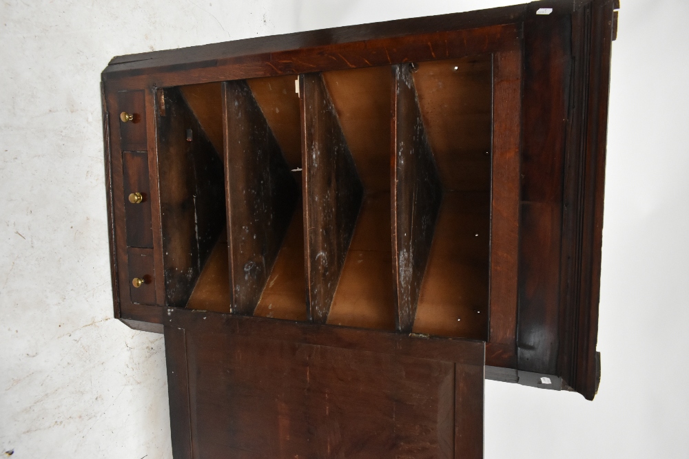 An 18th century oak flat fronted hanging corner cupboard, the single panelled door above three - Image 4 of 4