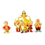 A Wade porcelain model of Snow White and five of her dwarfs, printed marks to base, height 17cm,