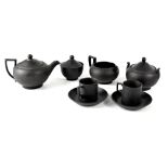A Wedgwood black basalt part coffee service in the Oriental style to include a small pot, creamer,