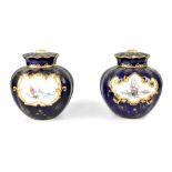 A pair of Royal Crown Derby covered potpourri vases of blue ground,