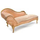 A Victorian gilt painted chaise longue with scrolled back,